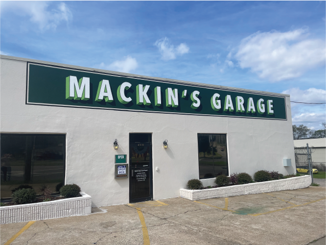 Mackins Garage Birmingham AL Green Sign White Lettering on Stucco Painted Wall Sign