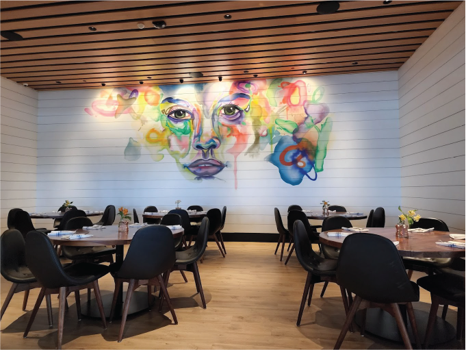 Private Dining Room Mural in the North Italia Restaurant in Orlando, FL. The mural depicts a woman's face in an abstract water color style. 